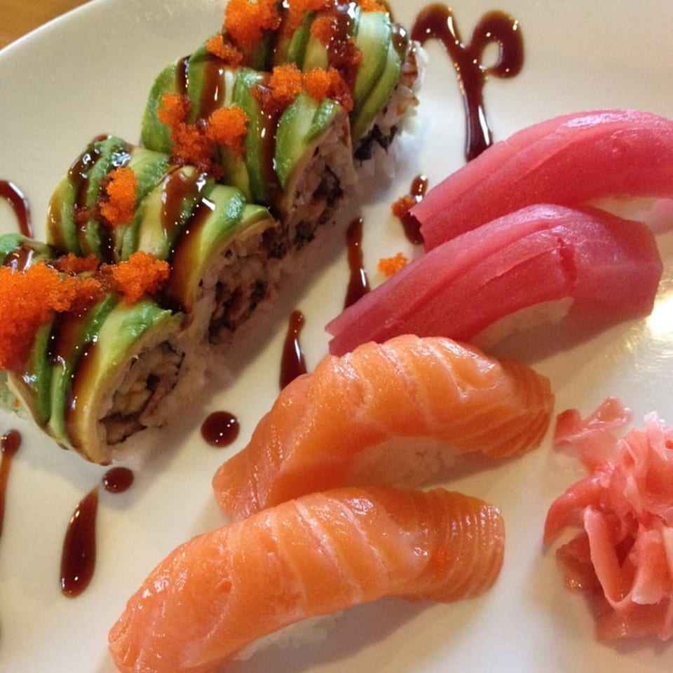 Kobe Hibachi Sushi and Bar's sushi platter with avocado rolls, tuna, salmon nigiri, and pickled ginger.